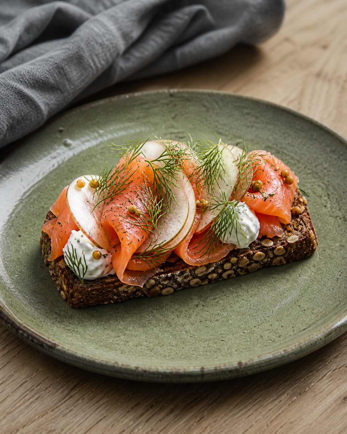 Cured trout and apple on seeded rye with dill