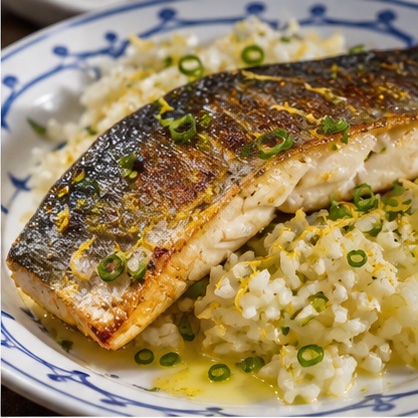 Crisp-skinned sea bass fillet over lemon rice